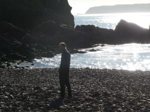 Callum on the pebbly beach